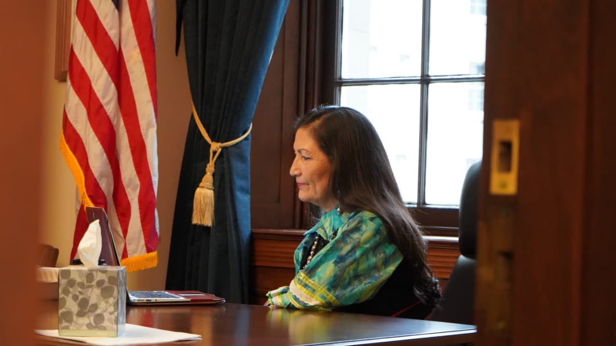 Deb Haaland with a laptop in 2019