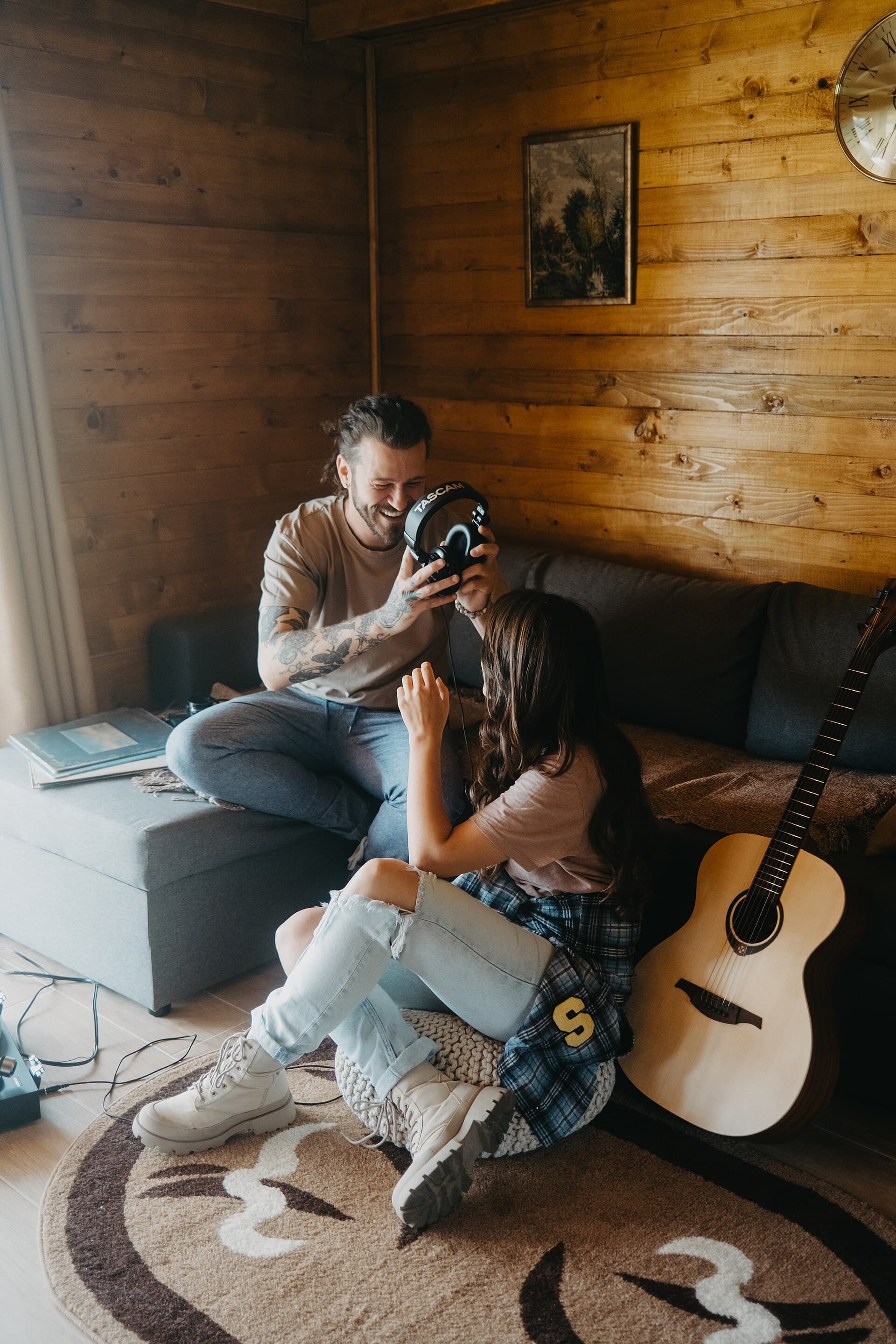 Couple sharing music experience in a cozy living room setting