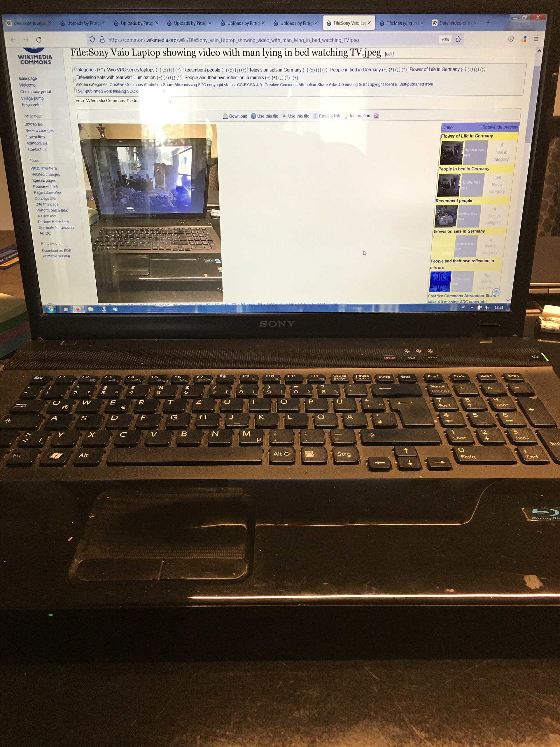 Image with nested realities of a laptop showing a Wikimedia Commons file with the same laptop showing video of