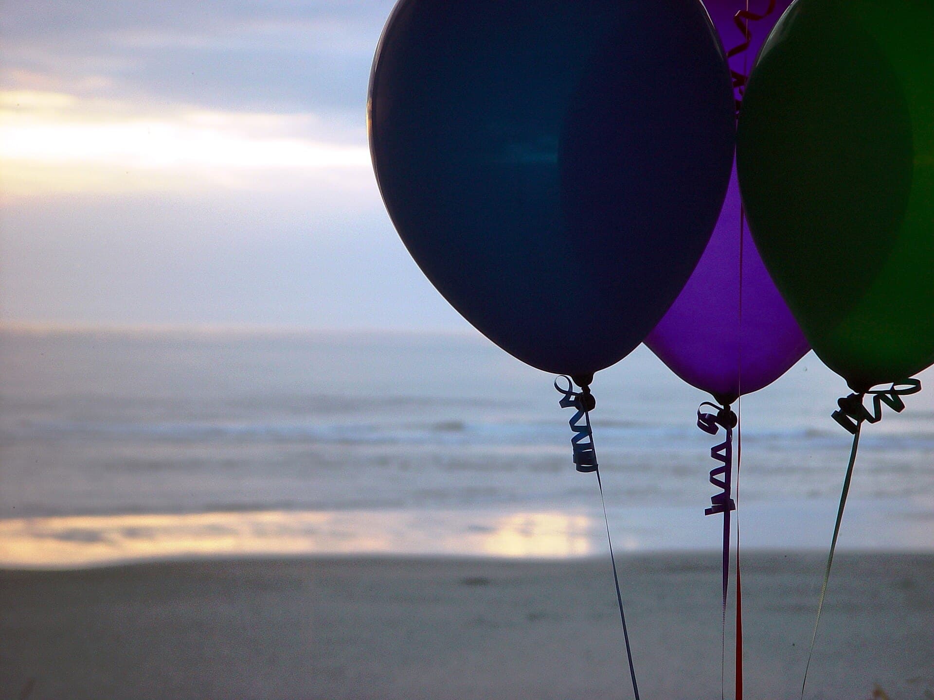 Balloons at Cannon Beach during sunset