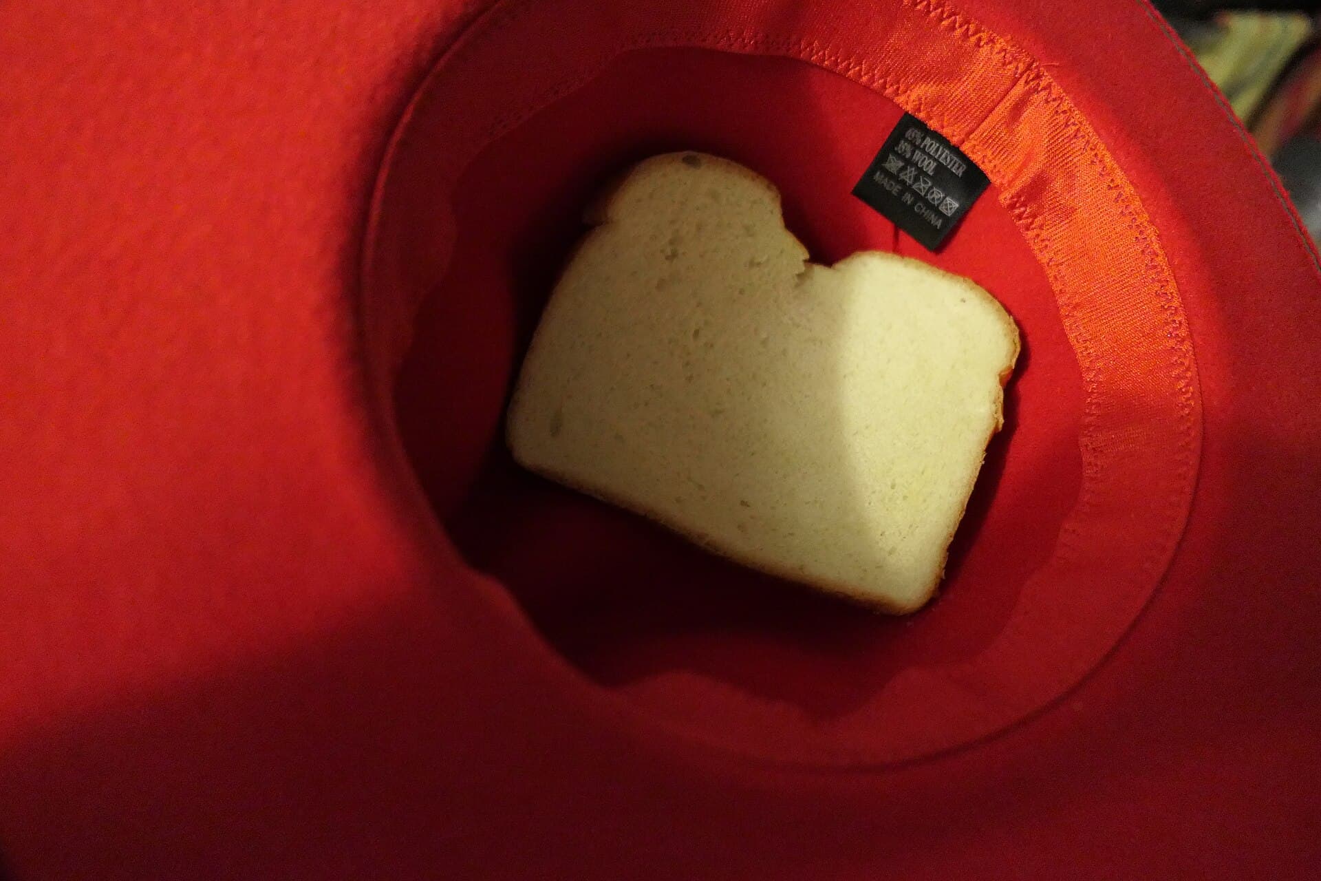 Bread in red felt hat slightly askew
