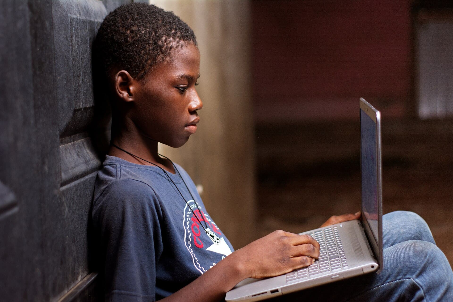 A boy using a laptop