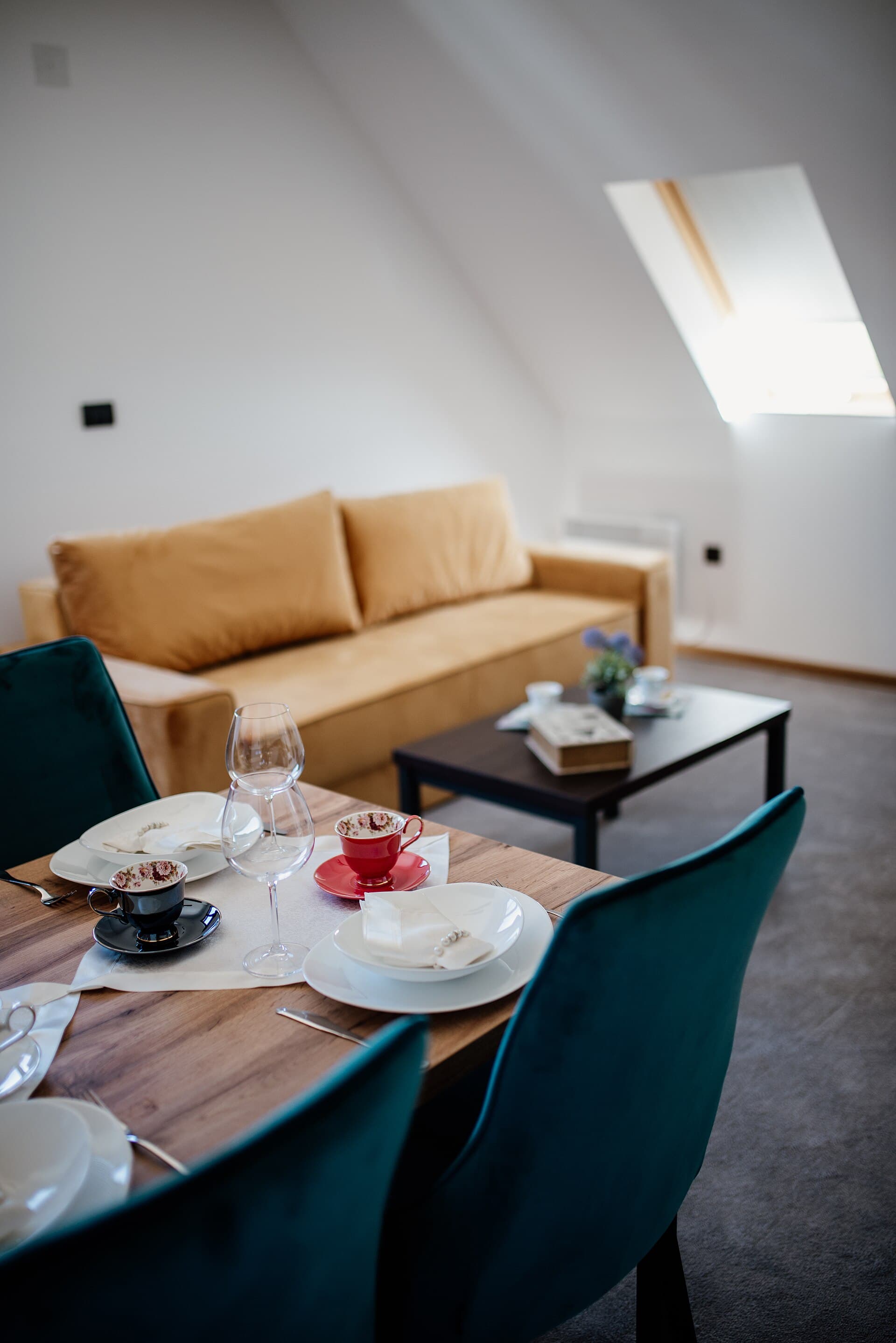 Cozy living room setting with a dining area, stylish decor, and warm ambiance for a relaxing gathering at suns