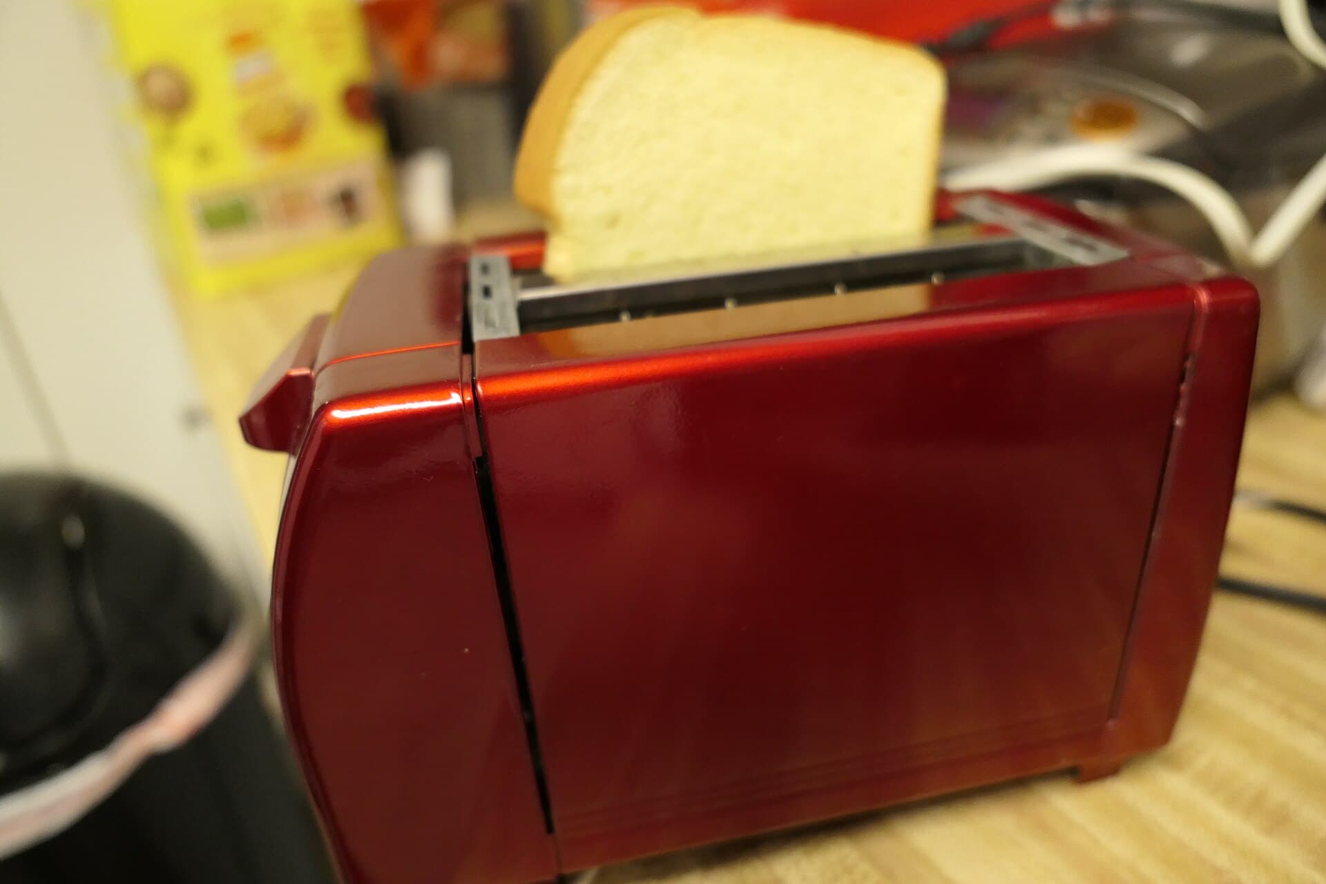 Bread sticking out of toaster